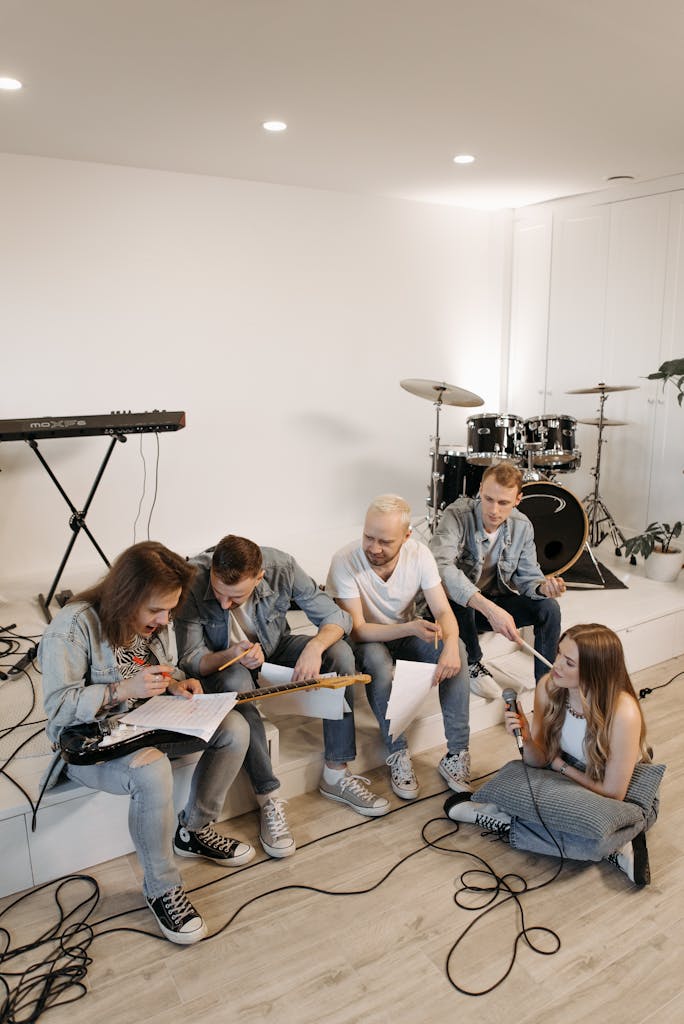 A Group of Friends Sitting Together while Having Conversation